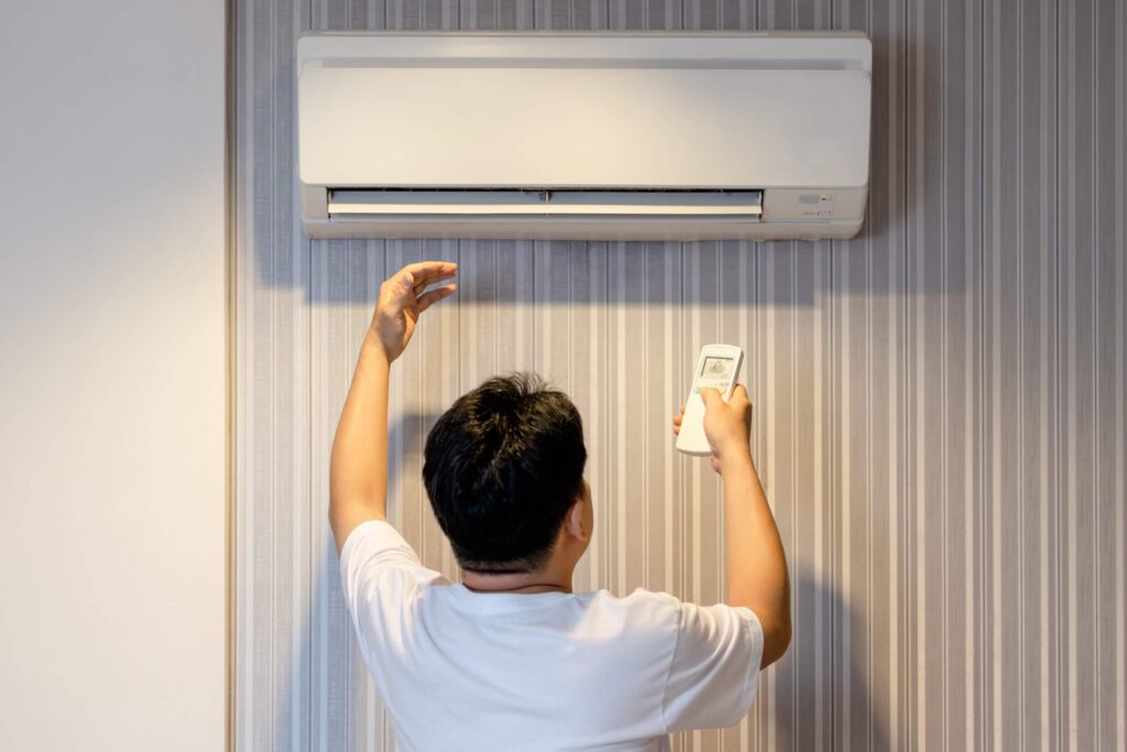 man having a problem with the air conditioner